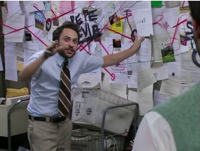 Charlie In It's Always Sunny Looking Manic In Front Of A Cluttered Planning